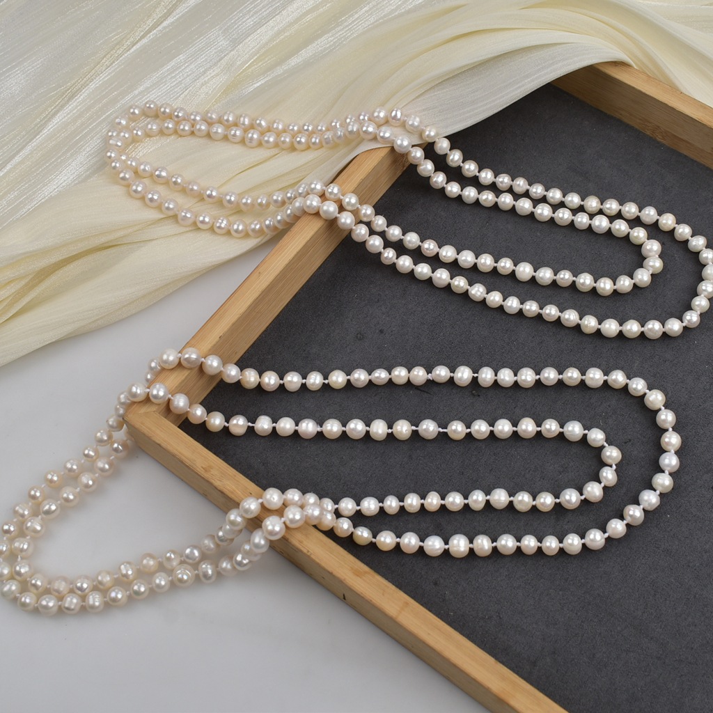 Long sweater chain cheongsam knot pearl necklace sweater chain natural freshwater pearl necklace elegant and simple style Application Scenario