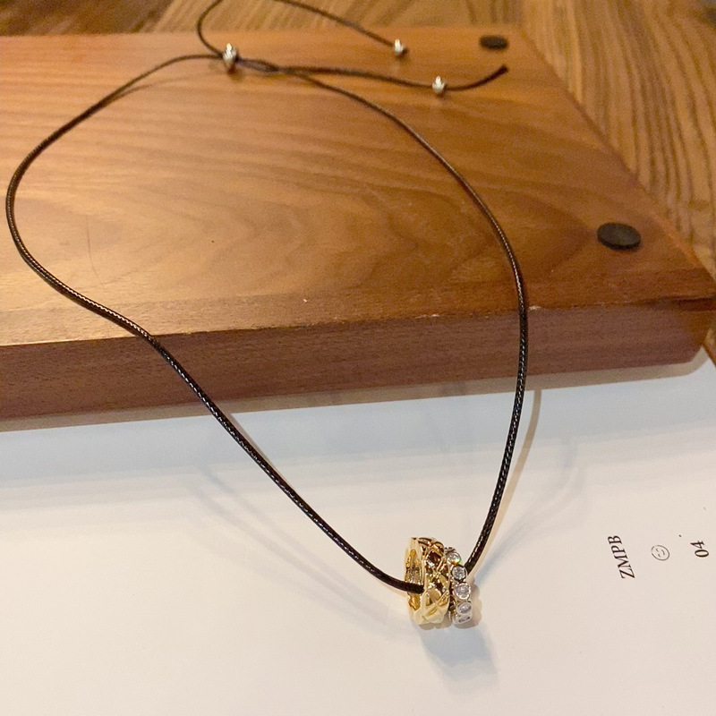 New autumn and winter style, fashionable and simple gold and silver ring black rope necklace, light luxury and unique design sense collarbone chain accessory details Picture
