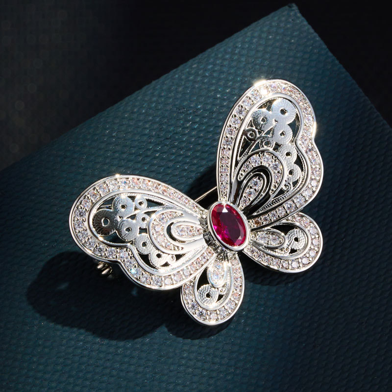 Light luxury retro hollowed-out red corundum butterfly brooch, copper alloy micro-inlaid zircon, high-end and exquisite women's brooch