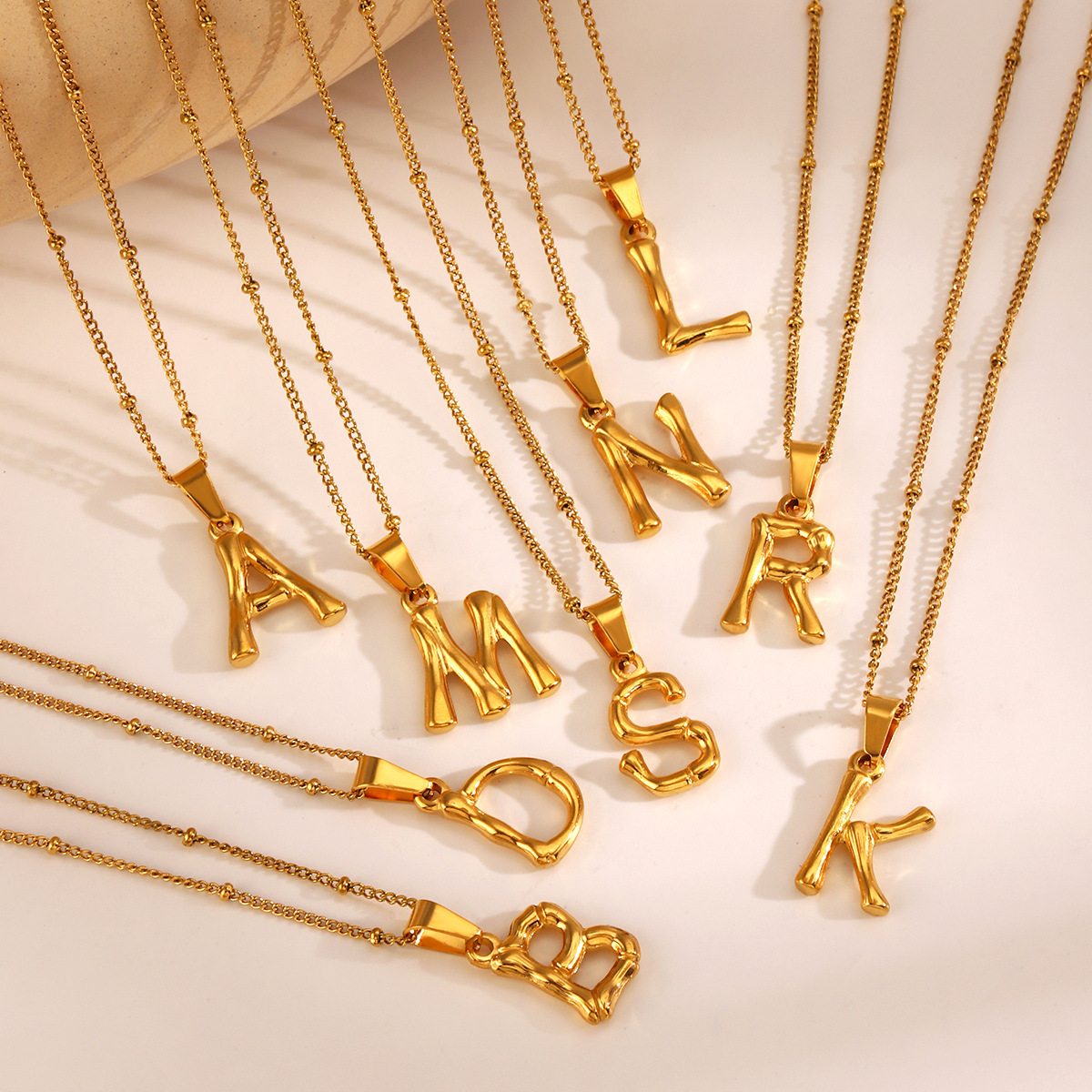 This is a trendy stainless steel 26-letter necklace with an InS-style niche design that is versatile. It features a bamboo joint letter collarbone chain