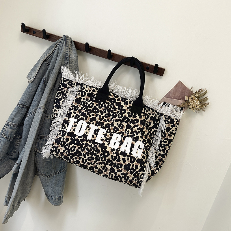 Cross-border canvas bag, denim print canvas bag, zebra print fringed letter canvas bag, large capacity bag, women's bag, new solid color commuting single-shoulder tote bag, beach bag, fringed canvas bag, tote bag, single-shoulder bag, canvas bag details Picture