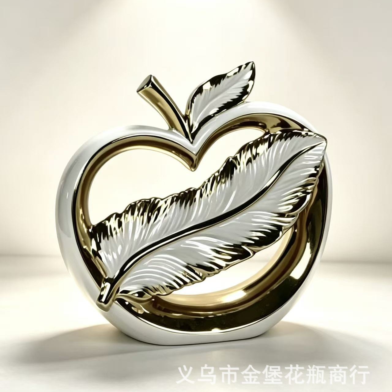 Light luxury white and gold streamlined hollowed-out heart-shaped apple ceramic decorative piece, abstract art home desktop soft decoration craftsmanship