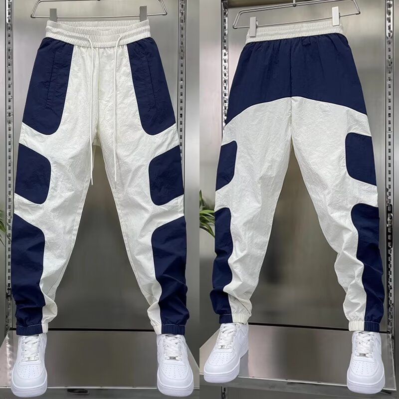 Men's trendy clothing brand offers high-quality men's casual pants for summer, featuring thin, color-blocked, tight-fitting, and stretched-waist sport pants