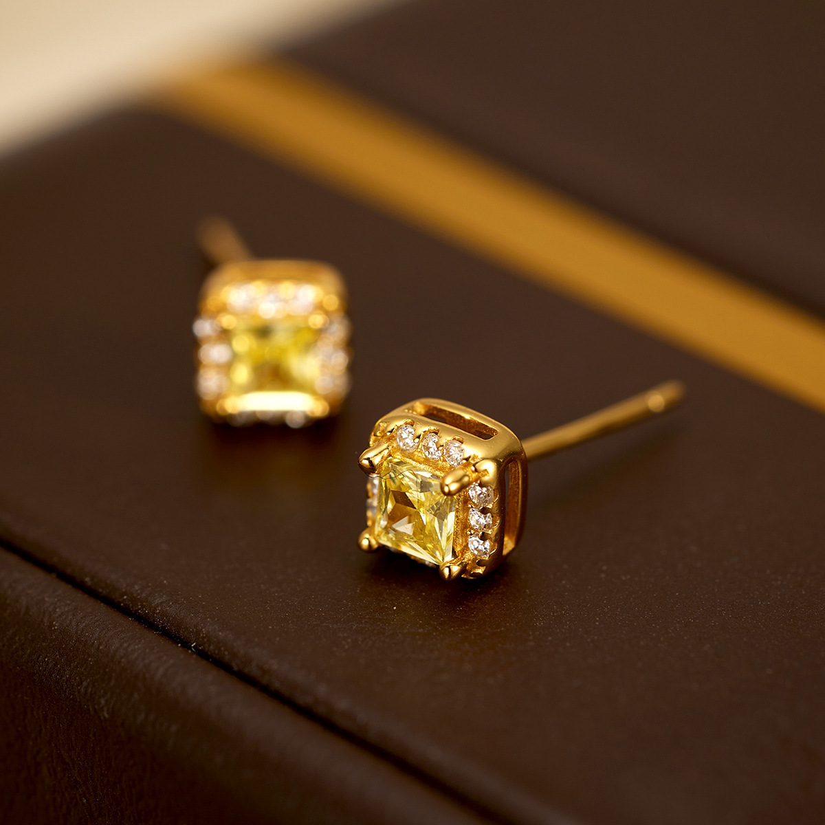 The new light luxury small square sugar stud earrings for women are fashionable and simple. The small square yellow diamond electroplated 18K silver earrings are selling well in Europe and America Specification image