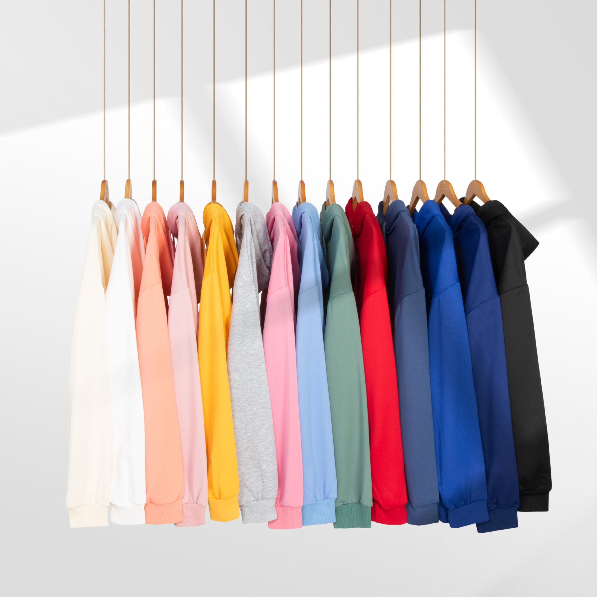 Cross-border Amazon Spring and autumn off-the-shoulder loose polyester solid color hooded sweatshirts for men and women, couple pullover long-sleeved shirts full figure