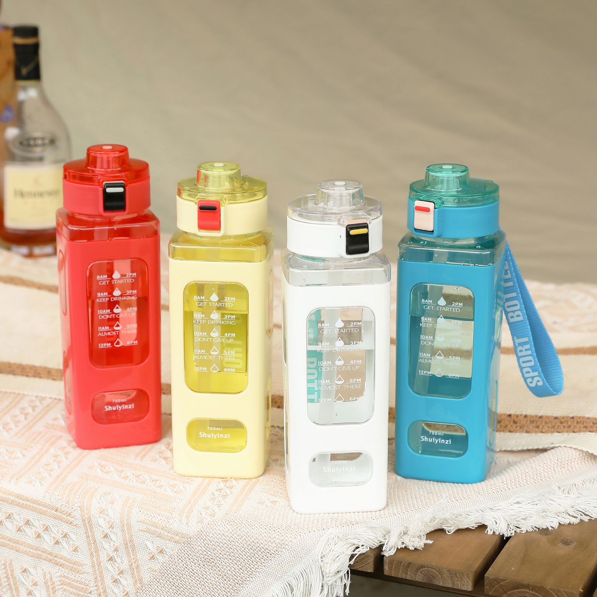 Outdoor portable cross-border simple square cup, straw cup, jumping lid, lifting rope, juice flower tea plastic water bottle, 700ml