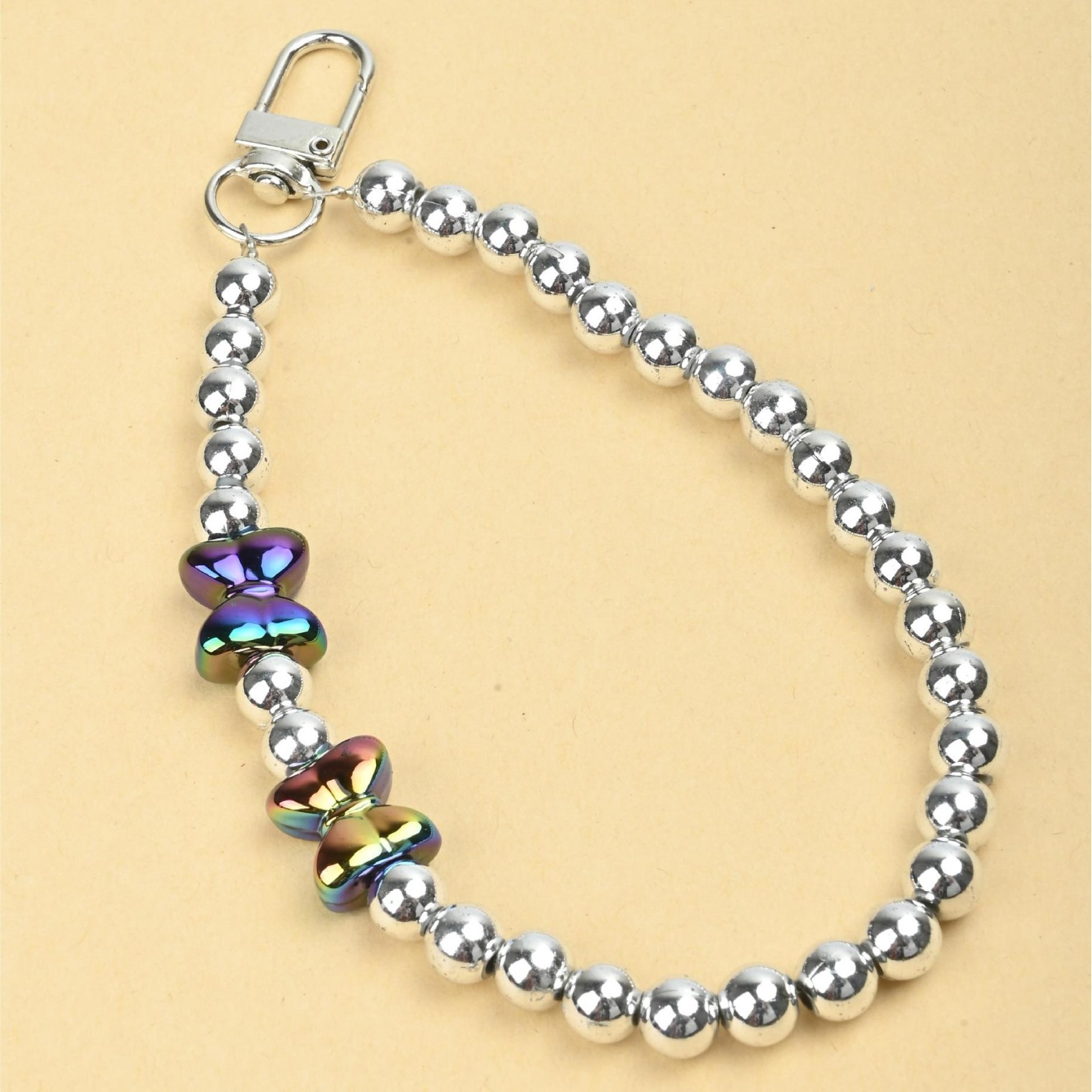 New acrylic pearl cute bow tie, handcrafted beaded mobile phone pendant chain, keychain, bag chain, fashionable accessory batch