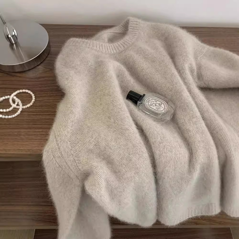 A high-end, soft and fluffy raccoon wool round-neck sweater for women in winter, thickened and laid-back style milk fufu, paired with a knitted sweater top