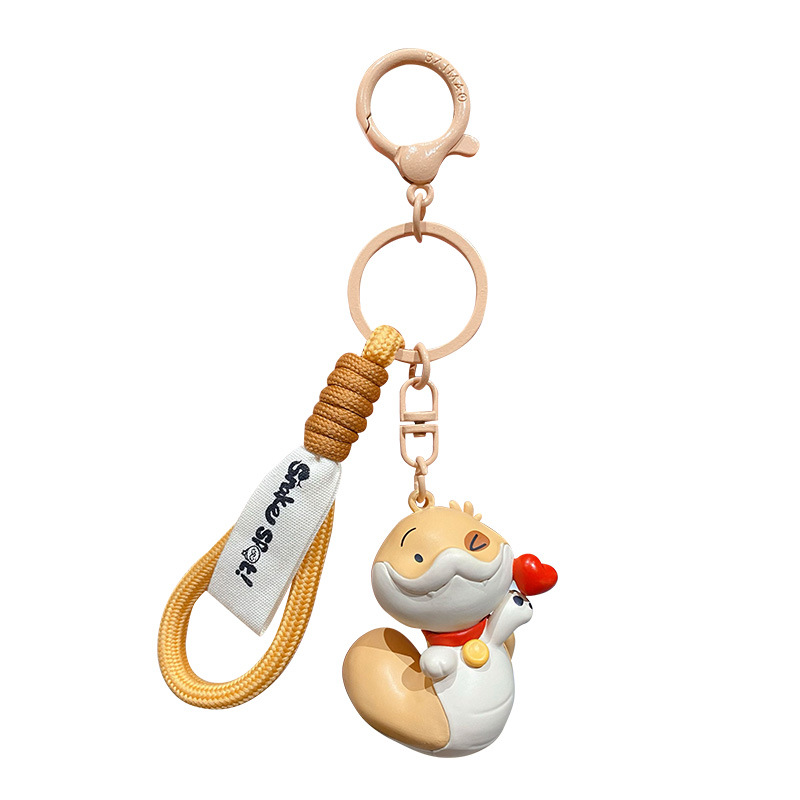 Genuine Snake Year puppy keychain, cartoon heart snake, injection-molded figure, schoolbag pendant, New Year small gift Item Picture