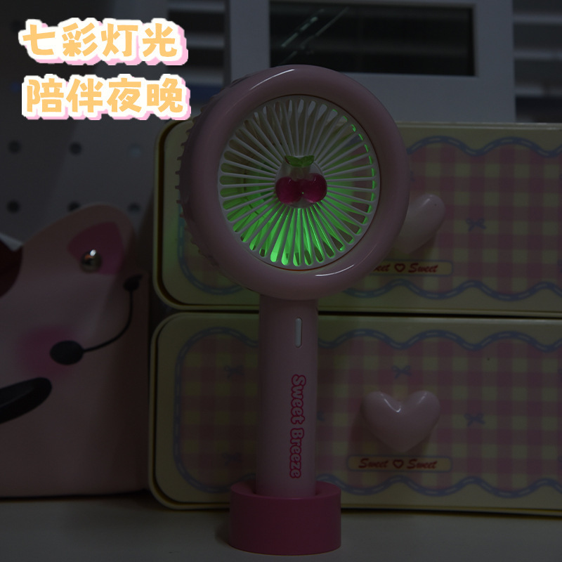 New cross-border cartoon handheld mini fan, summer cherry outdoor USB charging with light, student gift electric fan Application Scenario