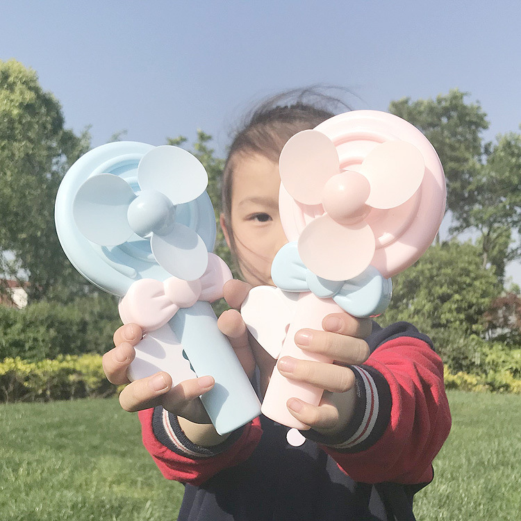 Cartoon lollipop hand-pressed children's mini fan, hand-held pressure fun fan gift advertisement with LOGO Application Scenario