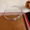 Wholesale of French light luxury, fashionable and retro diamond-encrusted four-leaf flower double-layer open bracelets with a unique and simple design sense Application Scenario