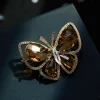 Ultra-glittering and high-end hollowed-out crystal butterfly brooch, copper alloy inlaid zircon, fashionable and versatile clothing pin, women's brooch Application Scenario