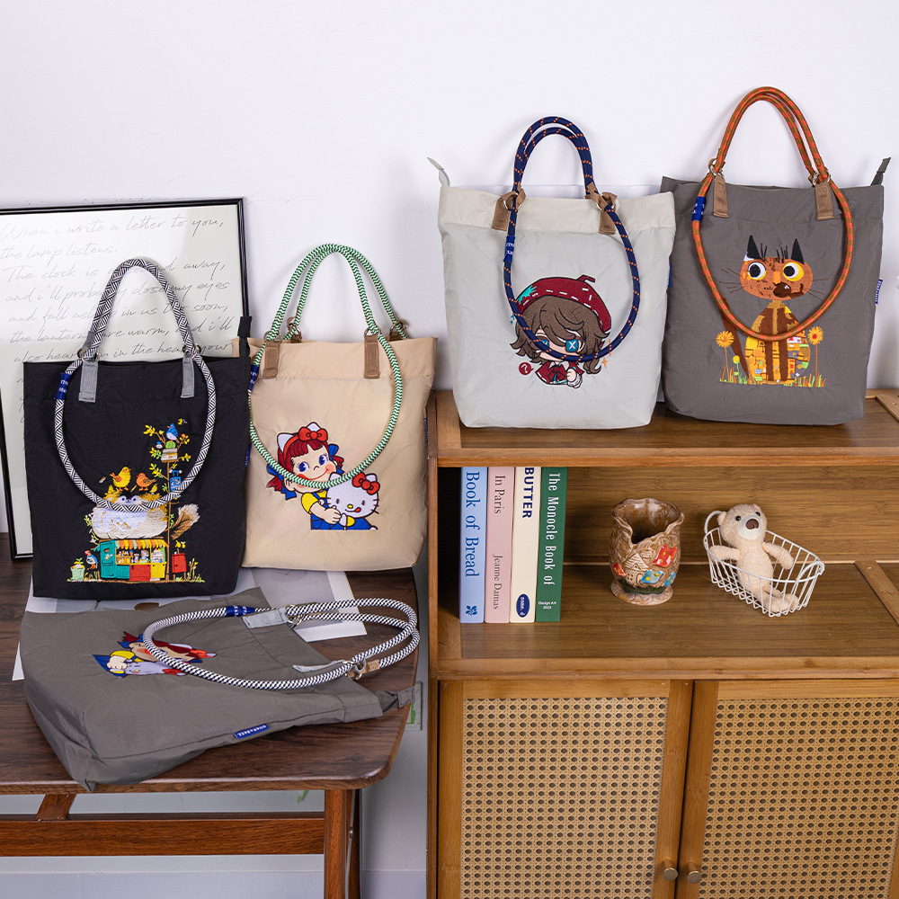 夏季新款卡通万针刺绣防水托特包小众百搭通勤早八大容量单肩包女产品图