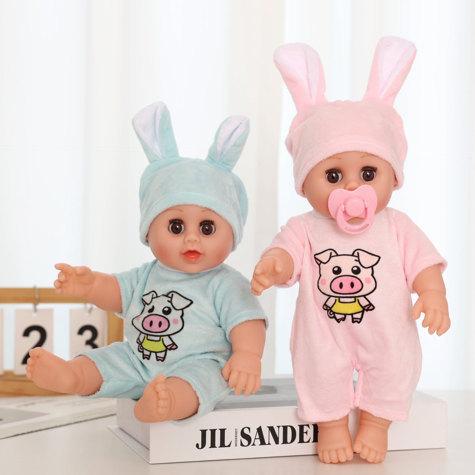 Wholesale of the new 12-inch eye-moving rebirth doll, a children's simulation soft rubber plush toy, and a role-playing toy details Picture