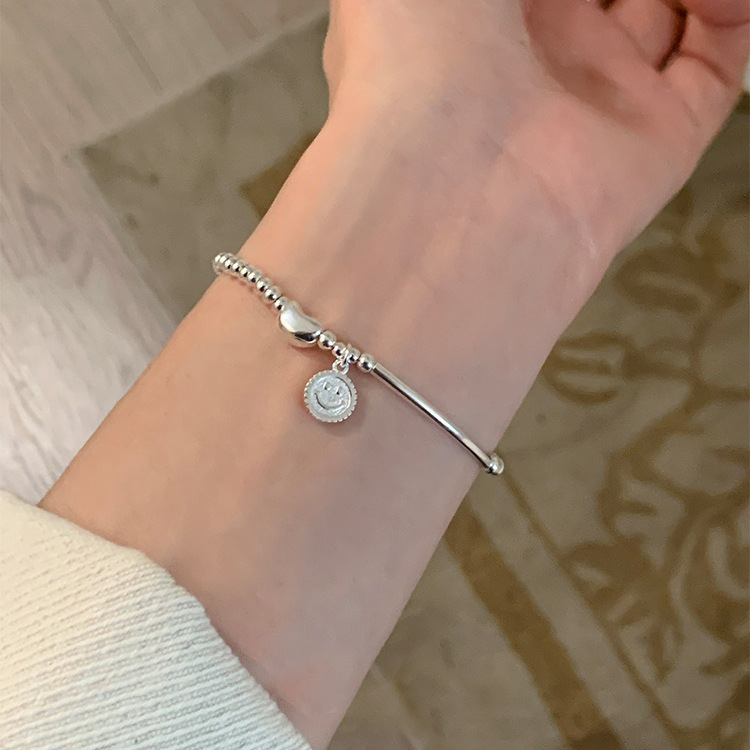 S925 sterling silver smiley face bean elastic beaded bracelet: simple and versatile, light luxury, ins niche jewelry with a sense of sophistication Specification image