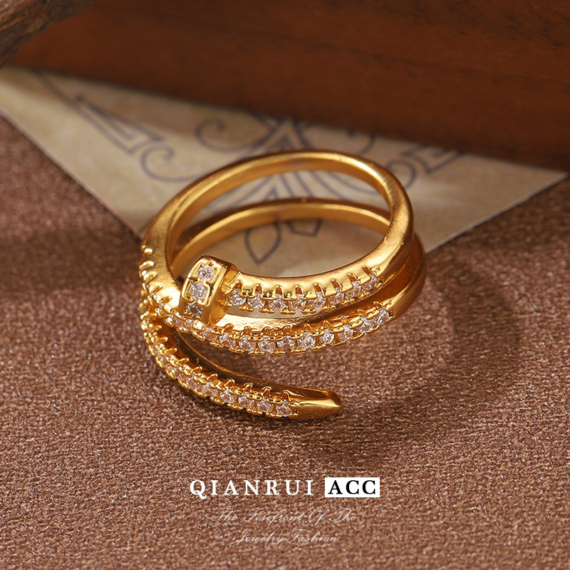 The personalized open-cut nail ring features a light luxury design. The full diamond nail ring is a cold lady's ring that does not fade and is French in style