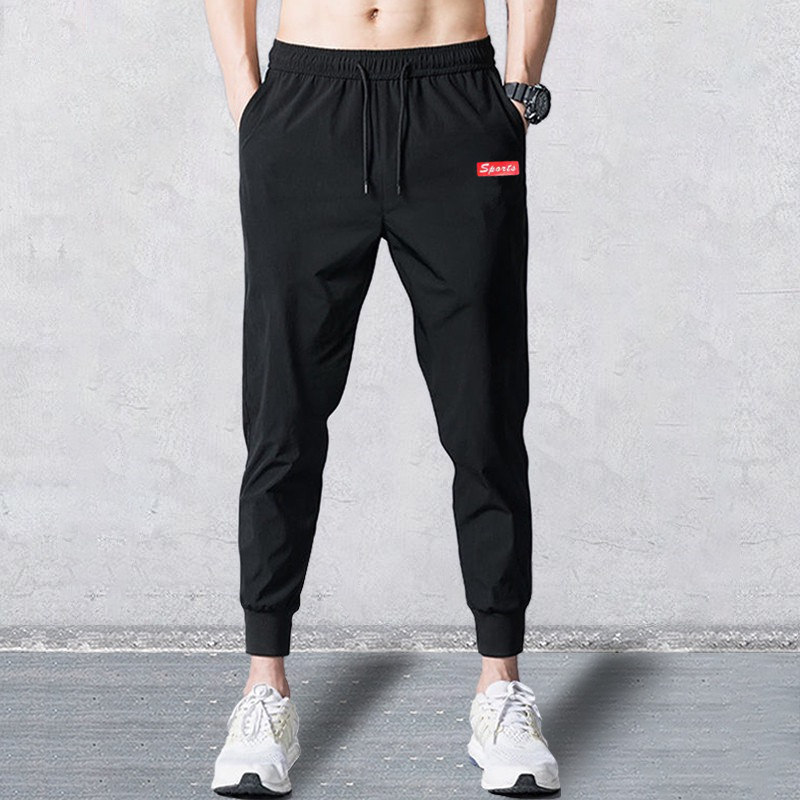 Wholesale sportswear and casual pants for men, loose and tight-fitting Korean style, trendy black small-leg Harun pants for spring and autumn