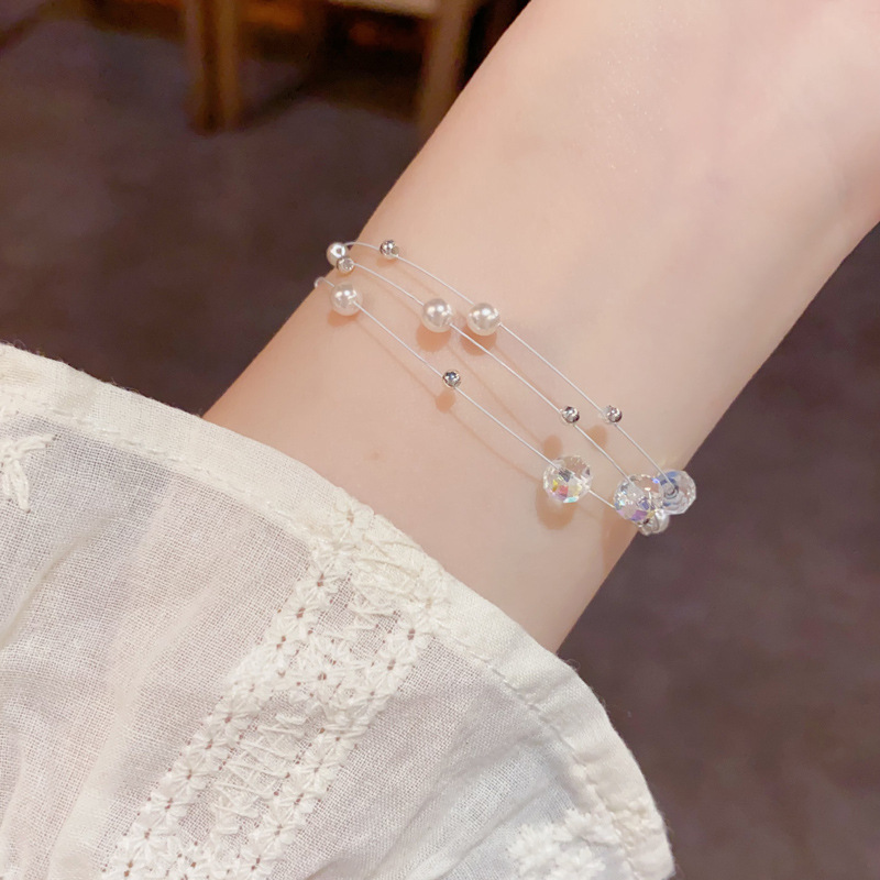 Amazon cross border fashion simple cristal perla de tres capas de línea de pesca pulsera temperamento ligero lujo diseño versátil sentido de la mano decoración