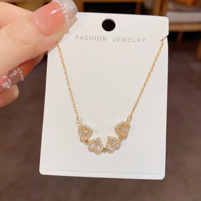 Four-leaf flower magnetic heart-shaped necklace for women, light luxury, fashionable and individual sweater chain, high-end and versatile collarbone chain accessory Specification image