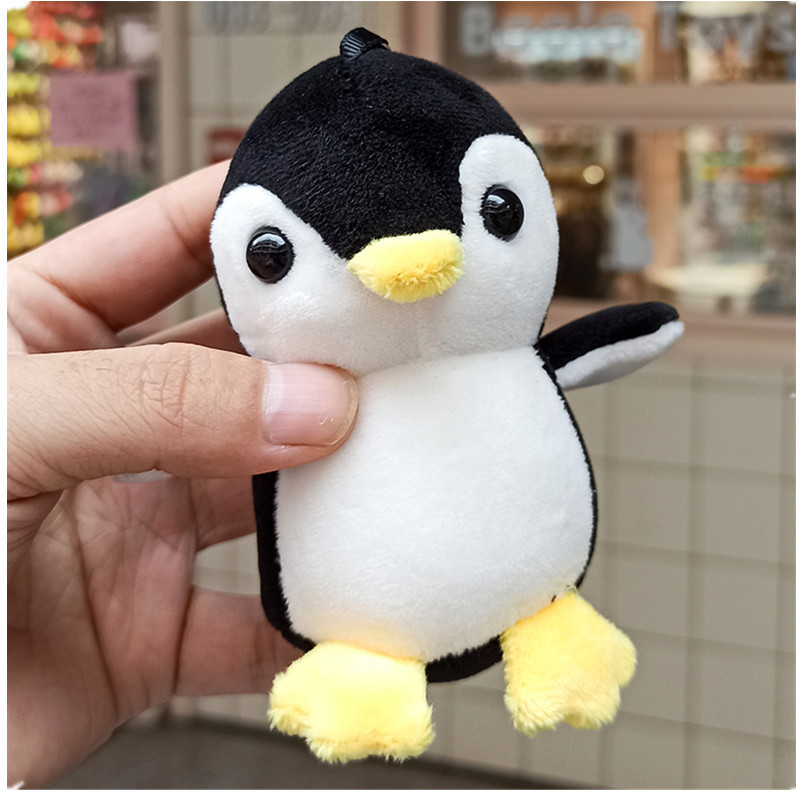 Wholesale of creative cartoon four-sided bouncing penguin plush pendants, cute animal dolls, bags, car keychains and pendants