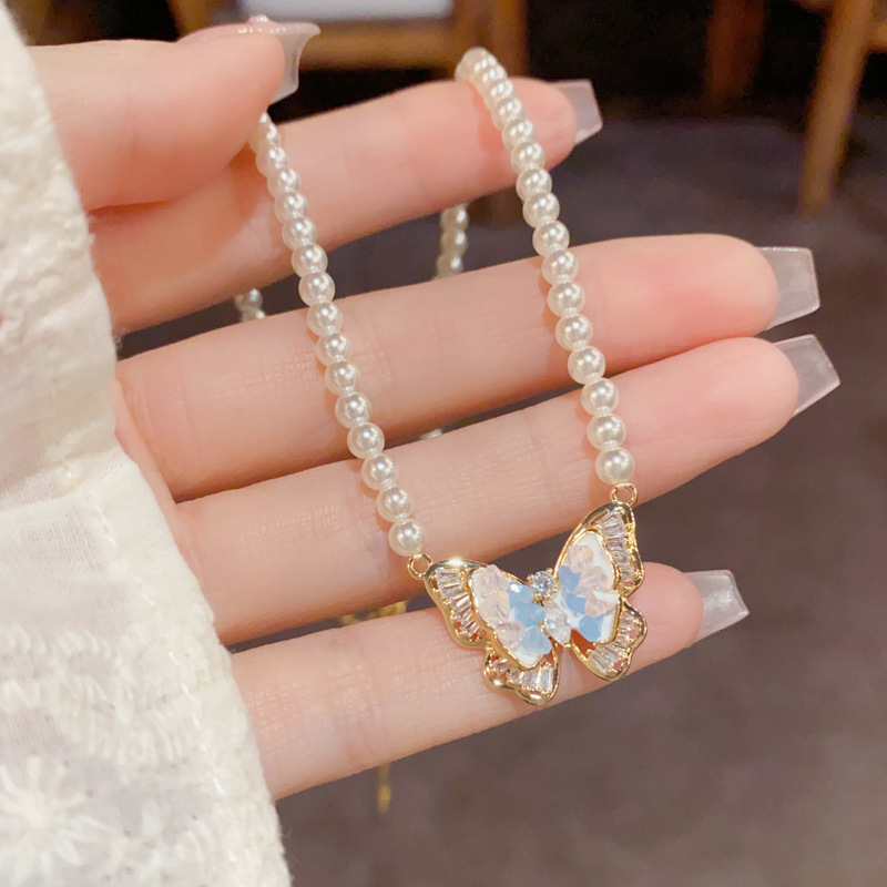Blue crystal butterfly pearl necklace, cold and elegant collarbone chain, light luxury, niche and high-end style, versatile earrings