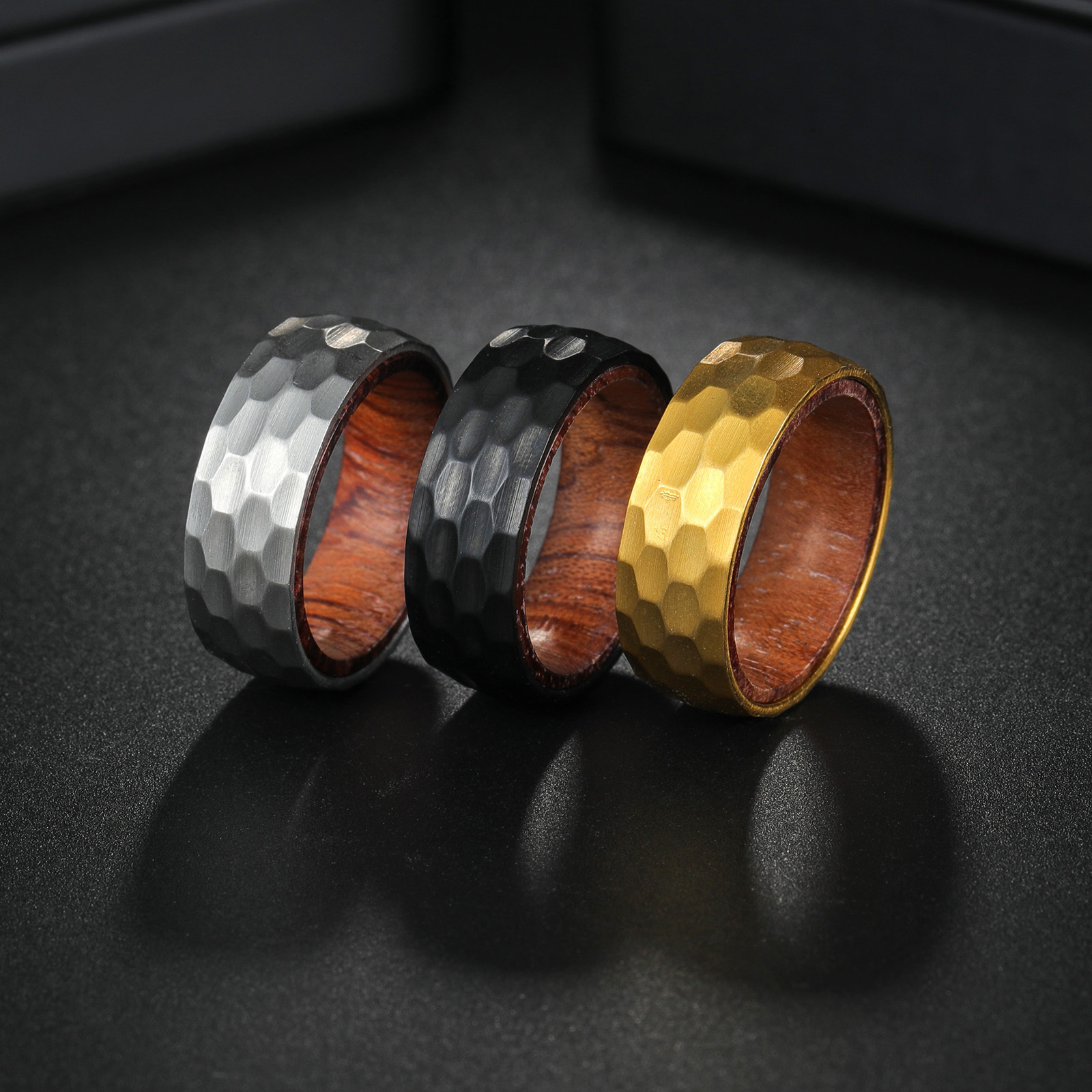 A new 8mm titanium steel jewelry piece with a hammered inner ring and pear wood inlay for men on Amazon's popular European and American products
