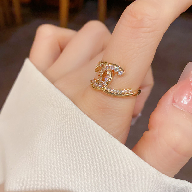 This is a new summer fashion Chanel style full-diamond letter open-mouth ring with a unique, light luxury, versatile and super shiny design Specification image