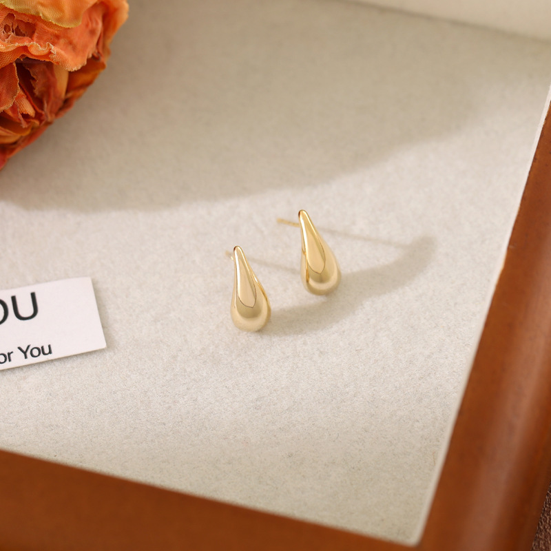 New simple, high-end and personalized ear stud earrings for women's fashionable commuting, small golden bean water drop ear stud accessories with a new design sense details Picture