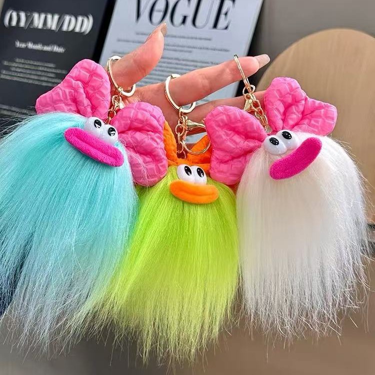 可爱蝴蝶结怪兽娃娃钥匙扣卡通搞怪毛绒书包挂件丑萌玩偶挂饰礼品产品图