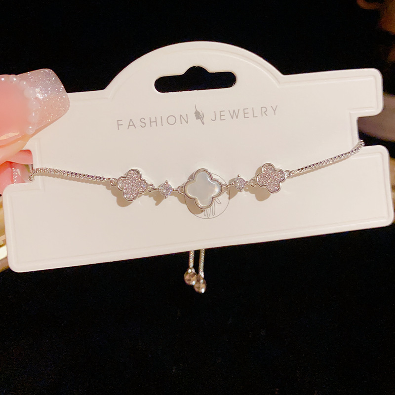 Alto grado de sentido influyente estilo explosivo micro incrustado madre de cuatro hojas pulsera de flores pull-pull-style mujer luz de lujo dulce temperamento pulsera de moda