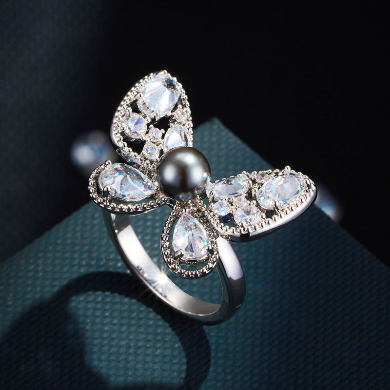 Dopamine purple-blue contrasting butterfly opening ring, copper alloy inlaid with zircon glass pearl adjustable exquisite ring Application Scenario
