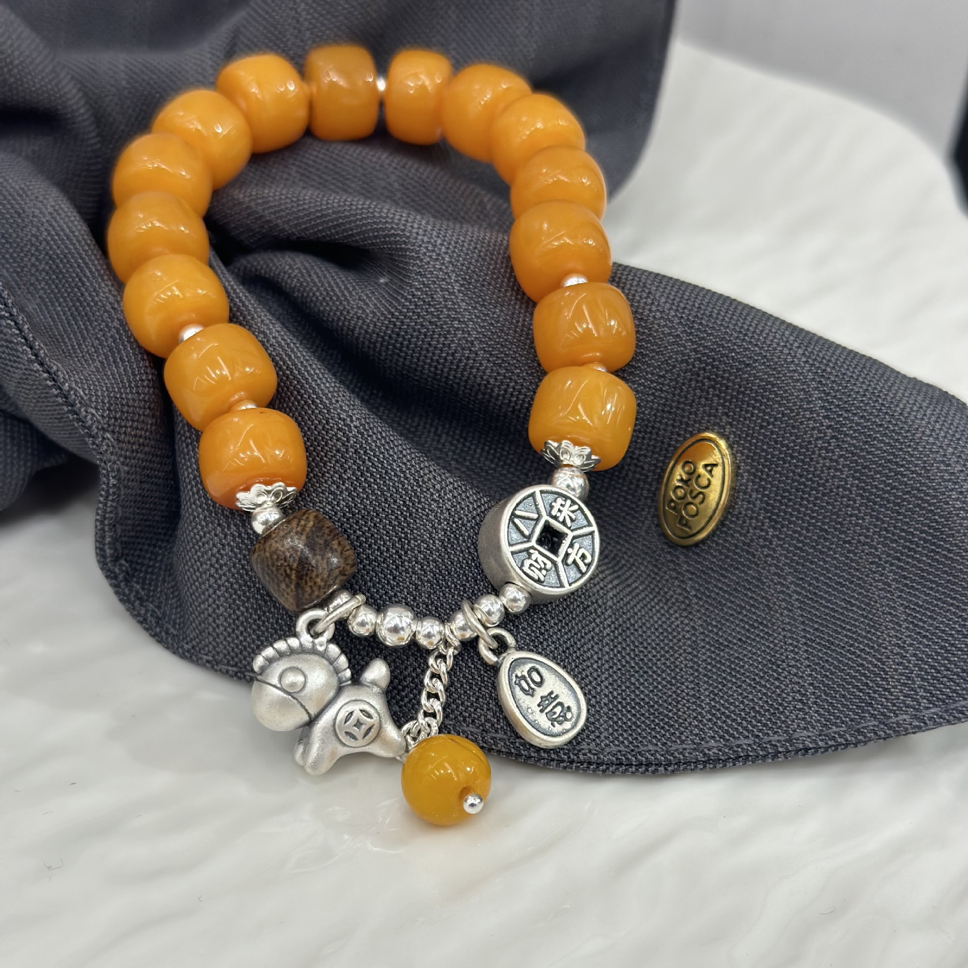 New Chinese-style "Money Coming Soon" wax bracelet, original S925 pure silver light luxury niche "Wealth Coming from All Directions" elastic rope bracelet details Picture