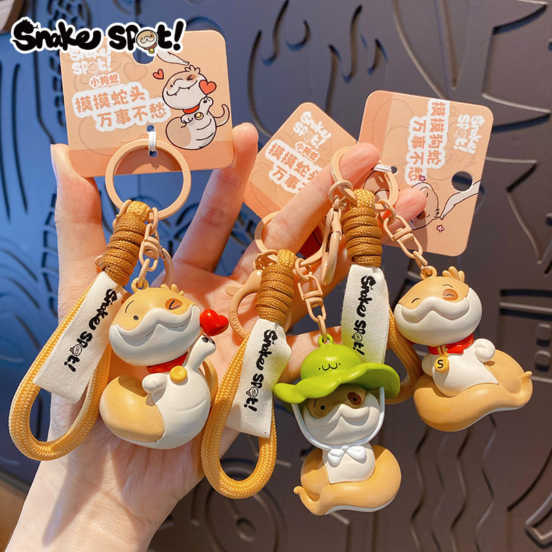 Genuine Snake Year puppy keychain, cartoon heart snake, injection-molded figure, schoolbag pendant, New Year small gift details Picture