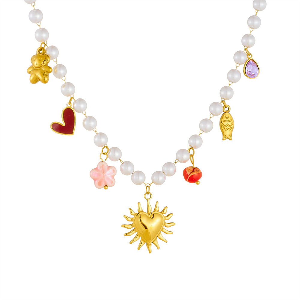 A retro pearl chain with a European and American cross-border style, gold-plated stainless steel smooth surface, heart-shaped round plate, resembling a dolphin necklace Item Picture