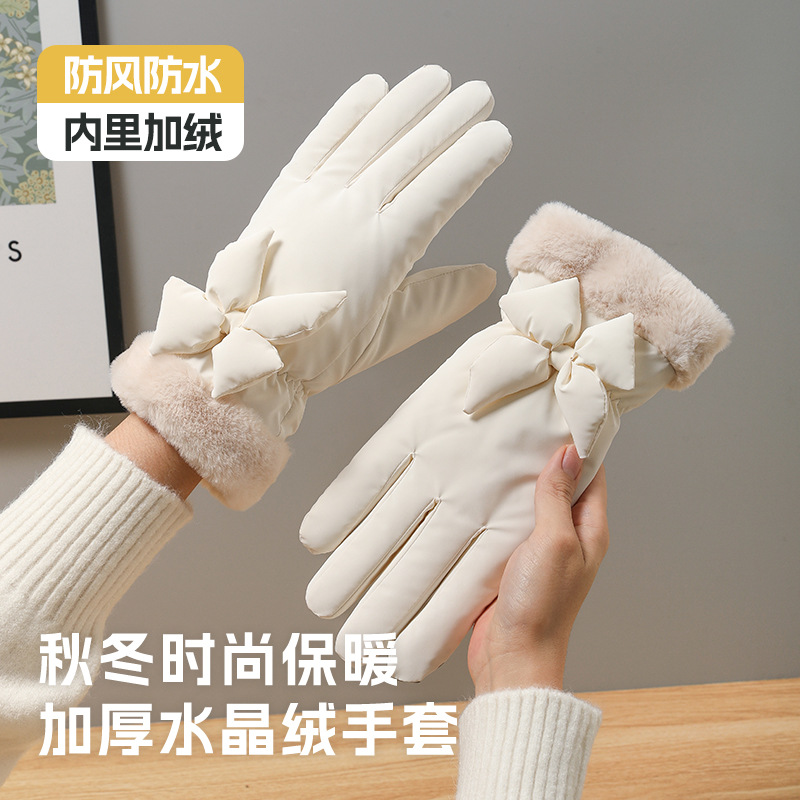 The girl with gloves for winter cold protection, thickened with fleece, keeps warm in winter. Skiing, cycling, outdoor sports, cycling touch screen, cute student