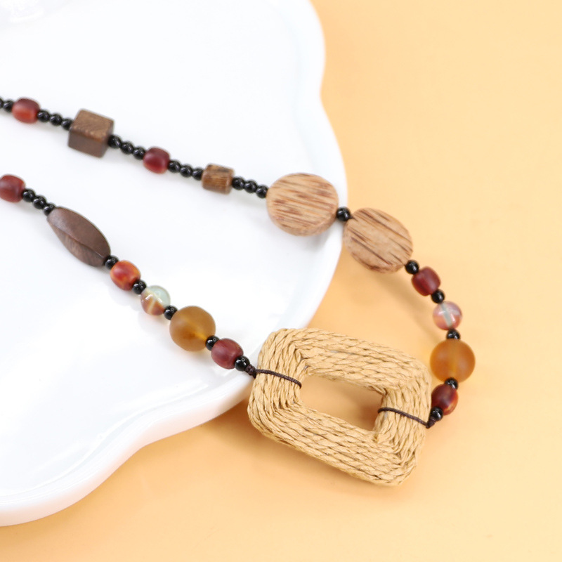 Xingni Original long coconut wood straw woven circle, long glass and solid wood sweater chain, retro ethnic style accessories cross-border Application Scenario
