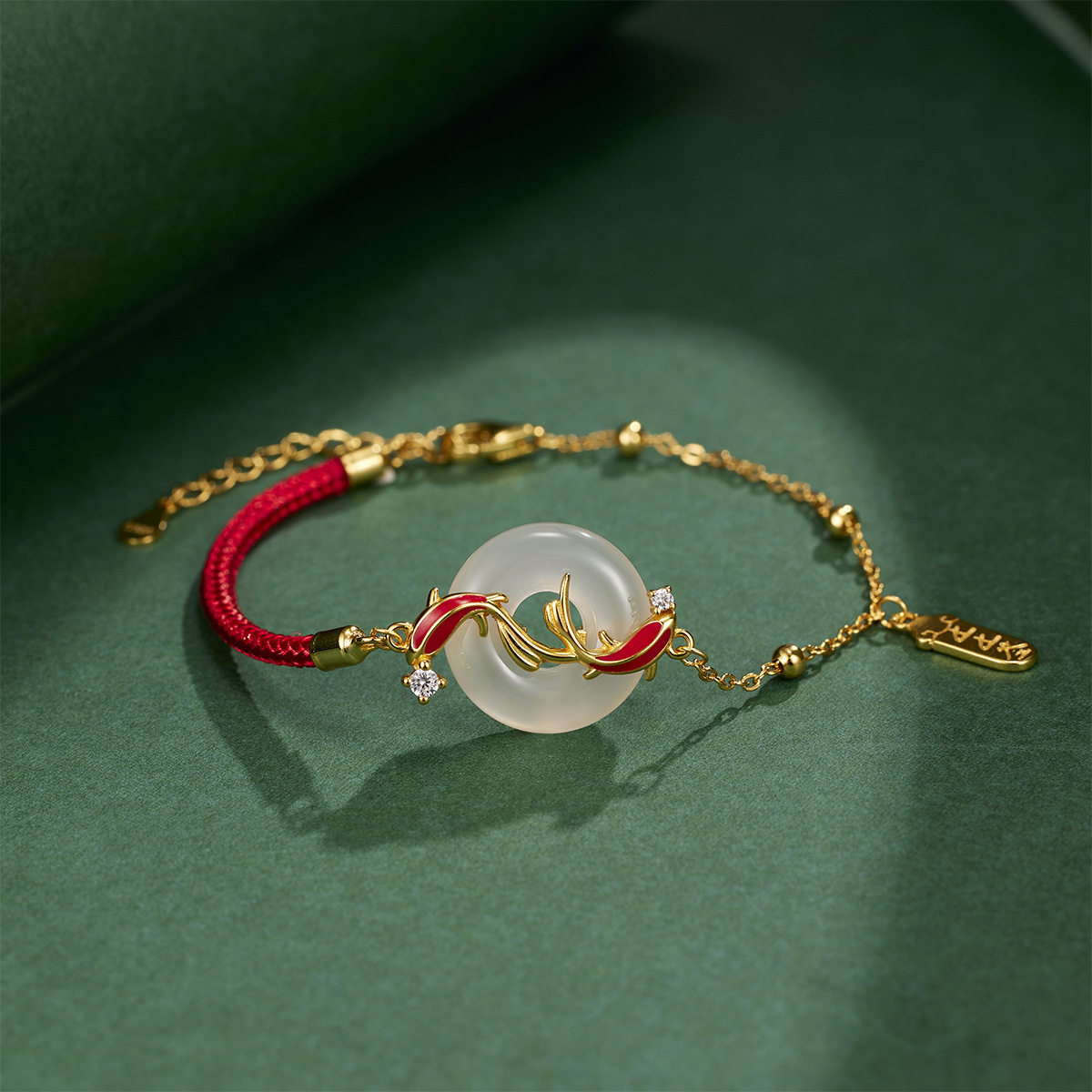 The ashore koi peace pendant with a red string and natural chalcedony is a fashionable and versatile jewelry for the zodiac year