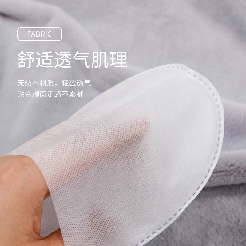 Wholesale of disposable slippers for hotels, household hospitality and travel supplies, non-woven fabric thickened slippers for hotels and homestays details Picture
