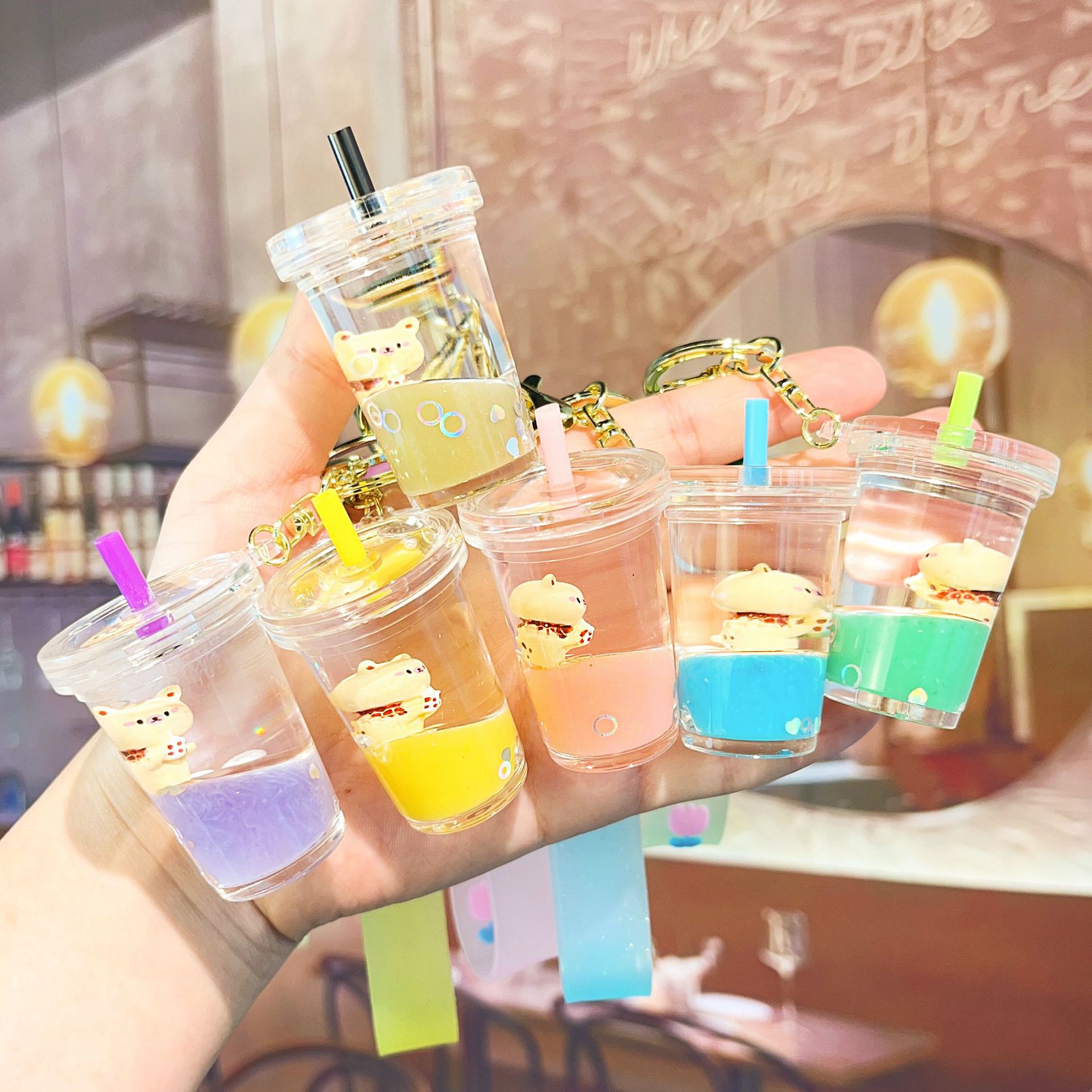 钥匙扣/卡通钥匙扣挂件/钥匙扣公仔挂件/带灯钥匙扣/流沙入油玩具产品图