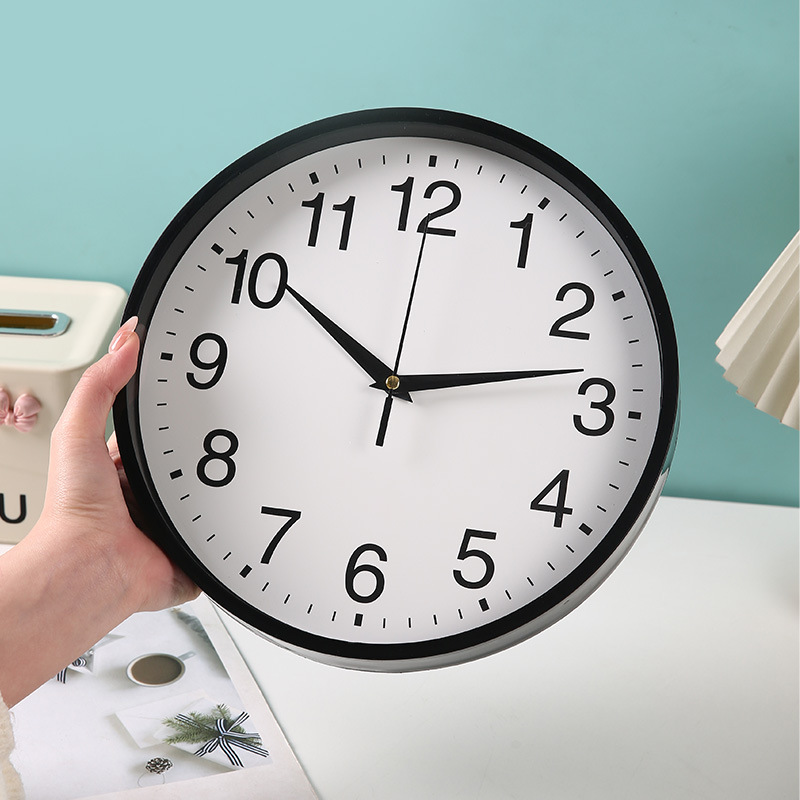 The new wall clock for the living room is a simple and fashionable Nordic home clock. It is a modern, creative and personalized quartz clock details Picture