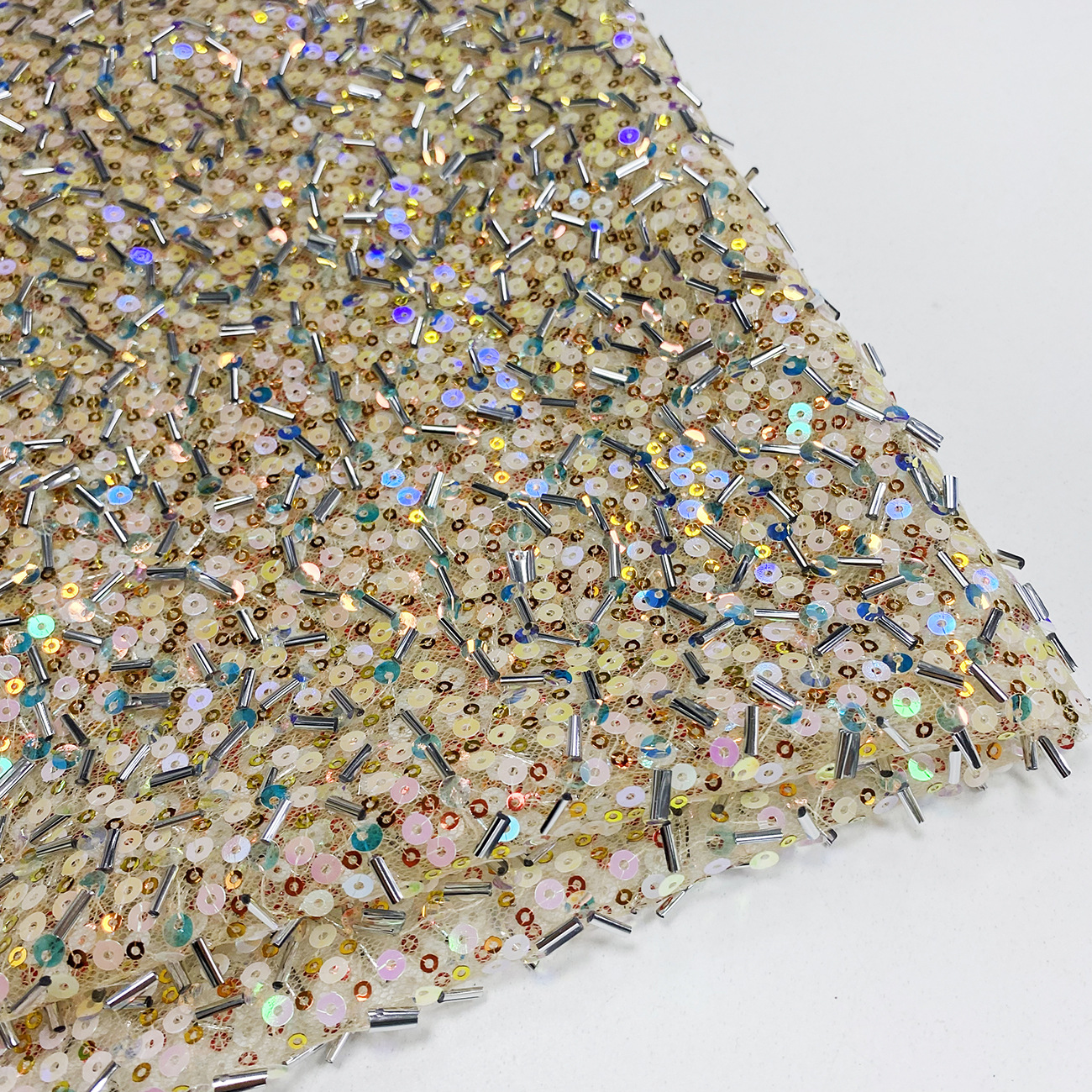 Embroidery ERylace, a fabric for wedding gowns and evening gowns with tube, bead, sequin, mesh fabric and lace embroidery, is in stock at the factory