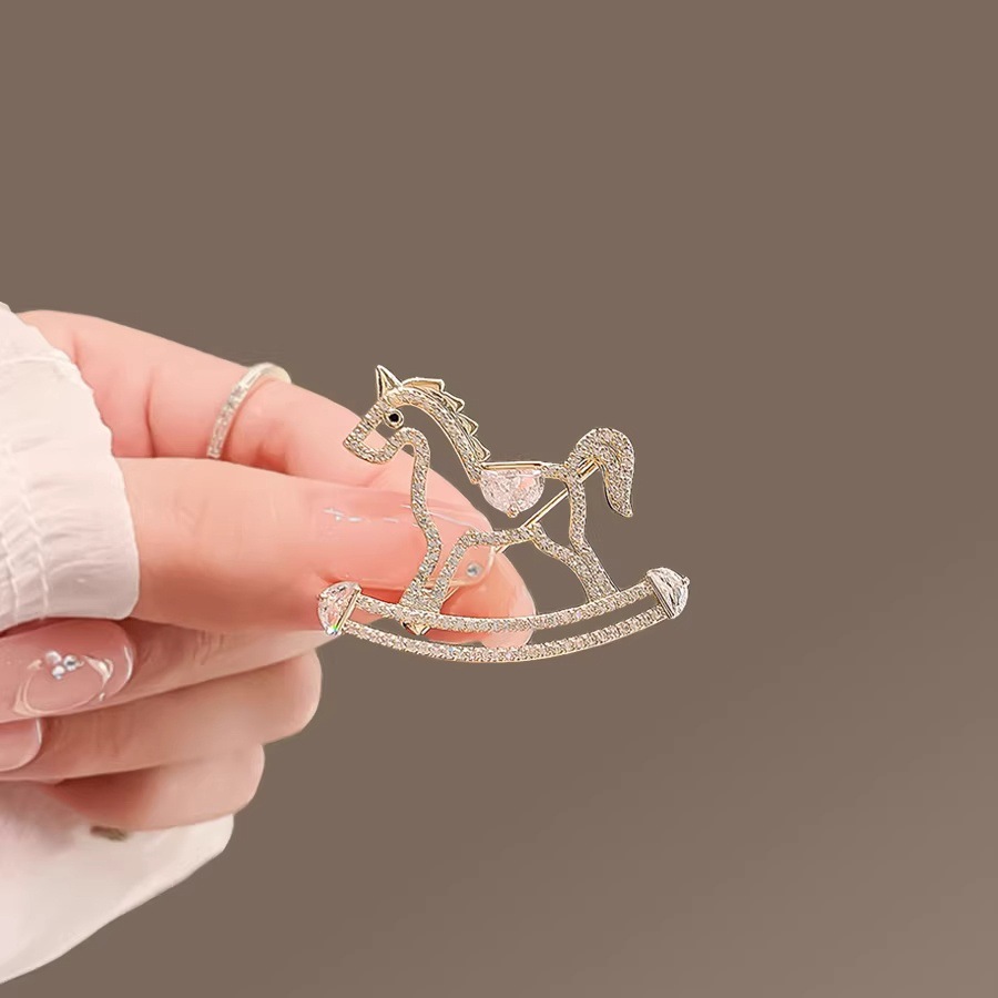 Exquisite hollowed-out wooden horse brooches for both men and women, cute and unique niche pins, summer anti-exposure clasp, and elegant corsage accessories details Picture