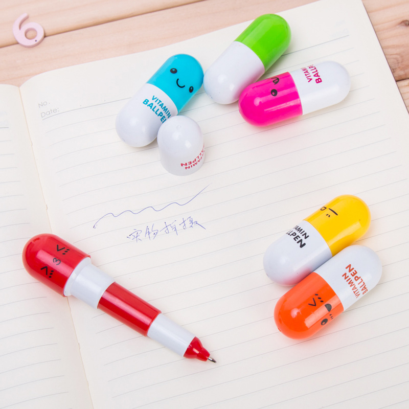 P-0128 Simple, new, cute cartoon smiling face telescopic capsule Ballpoint pen pill Pen stationery Item Picture