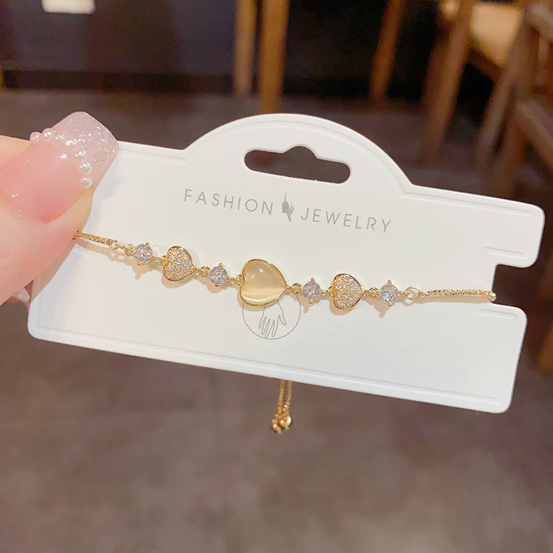 The sweet and light luxury cat's eye stone heart-shaped pull-out bracelet of the same style as Douyin, with a fashionable and high-end feel, is a simple and versatile bracelet Specification image