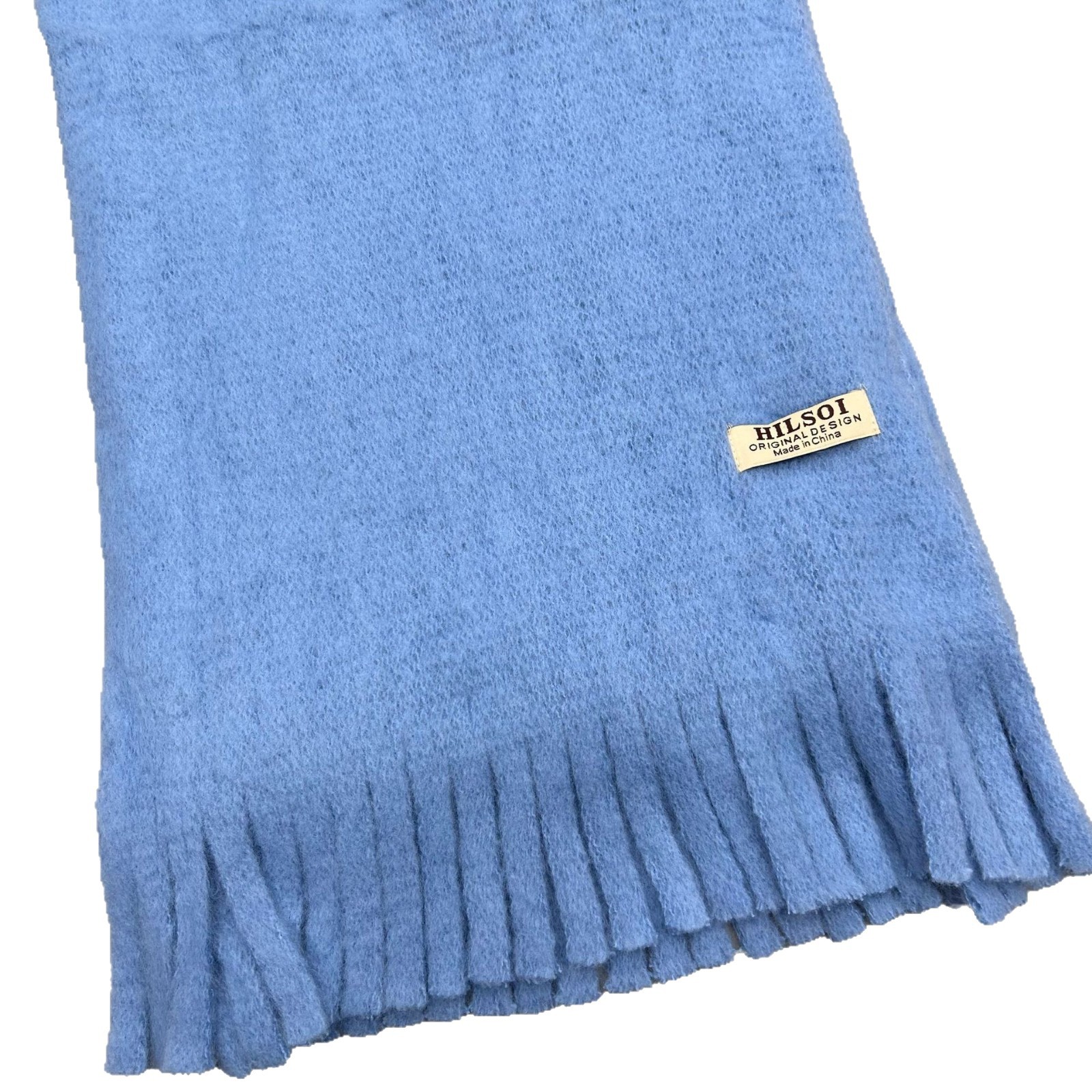 The 2024 new solid-color scarf is a must-have for women, providing warmth in winter. It's a Japanese-style, fashionable and versatile design. The thickened tassel faux cashmere scarf is also available Item Picture