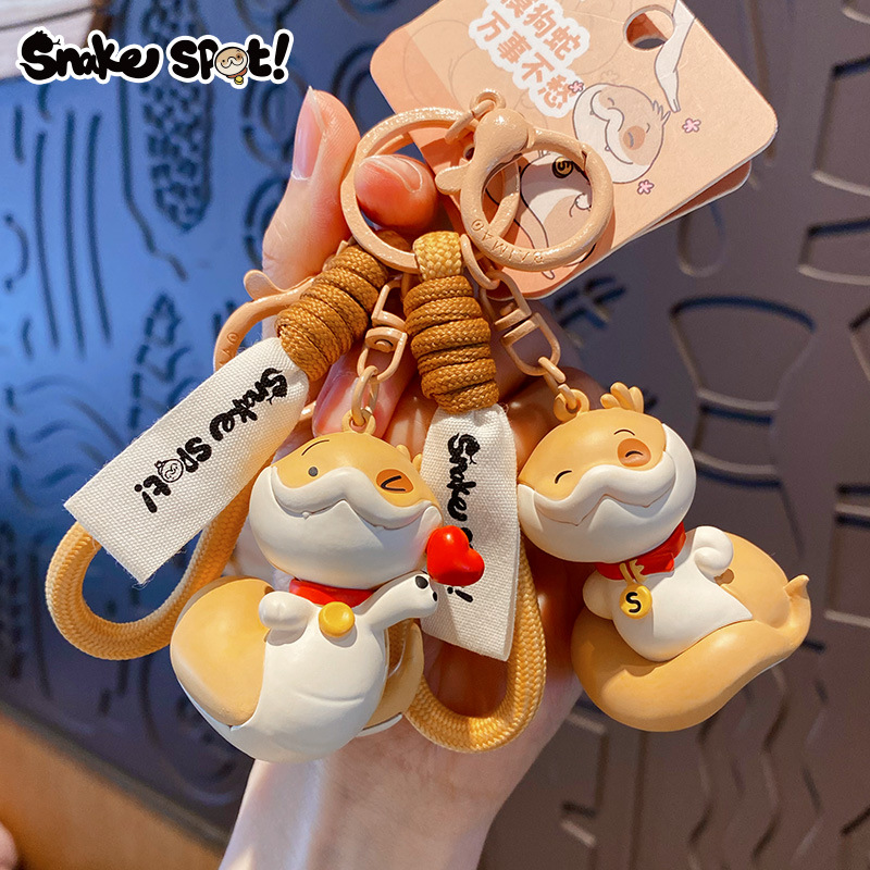 Genuine Snake Year puppy keychain, cartoon heart snake, injection-molded figure, schoolbag pendant, New Year small gift