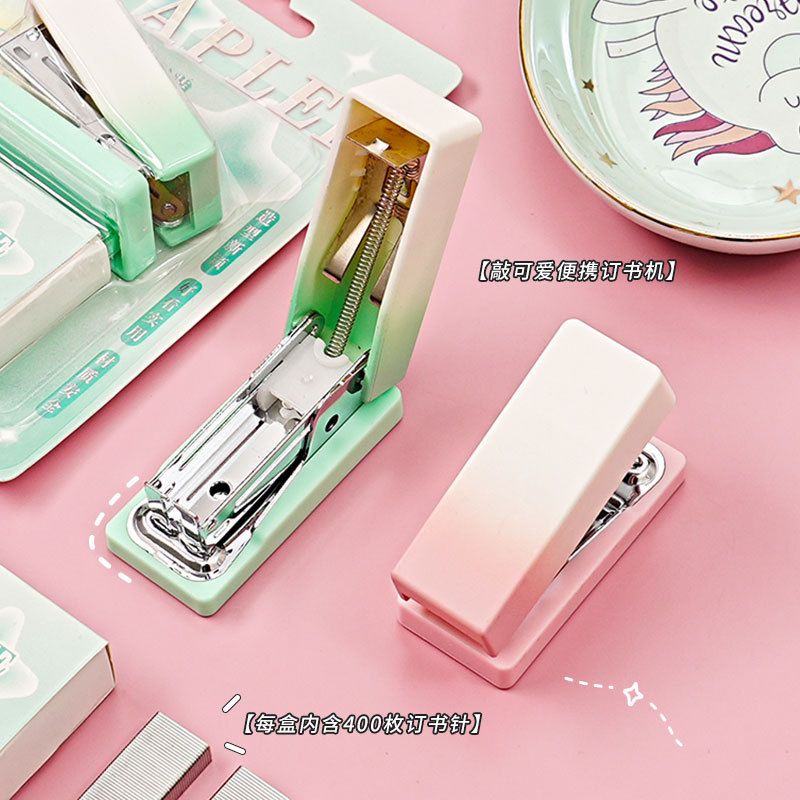 High appearance level gradient mini stapler set, available in multiple colors, student and office portable and effortless stapler, stationery pad Application Scenario