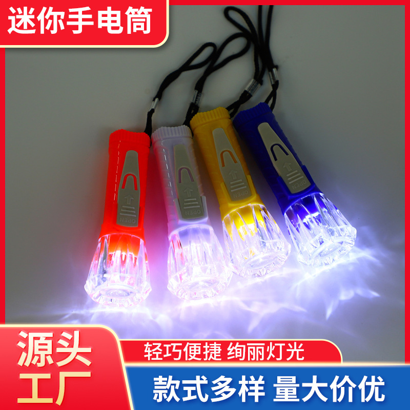 Hot-selling transparent mini toy flashlight, electronic light-emitting portable LED lamp, plastic small flashlight gift direct sales