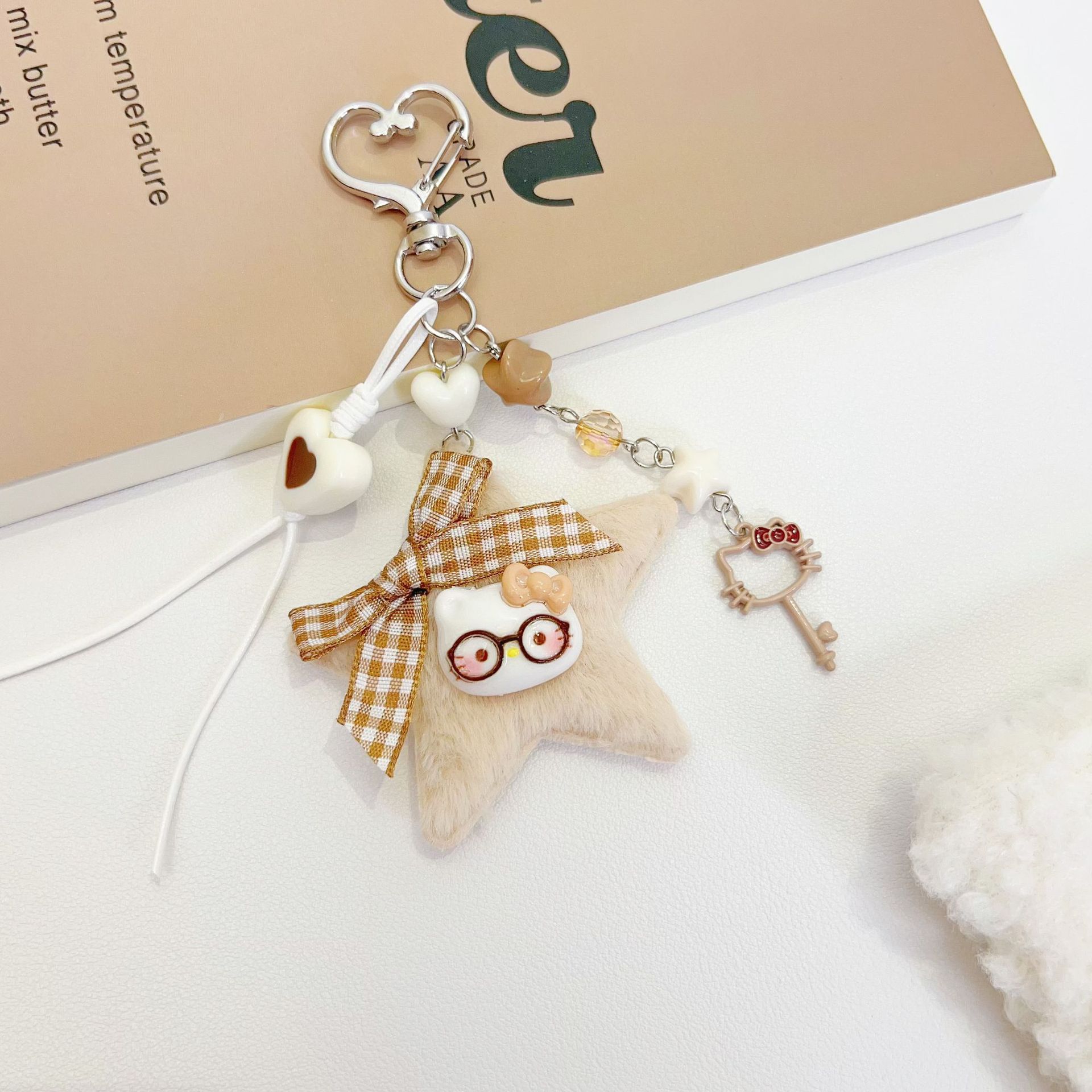 原创新款卡通五角星包挂咖色系猫咪钥匙扣百搭手工编织包挂件批发细节图